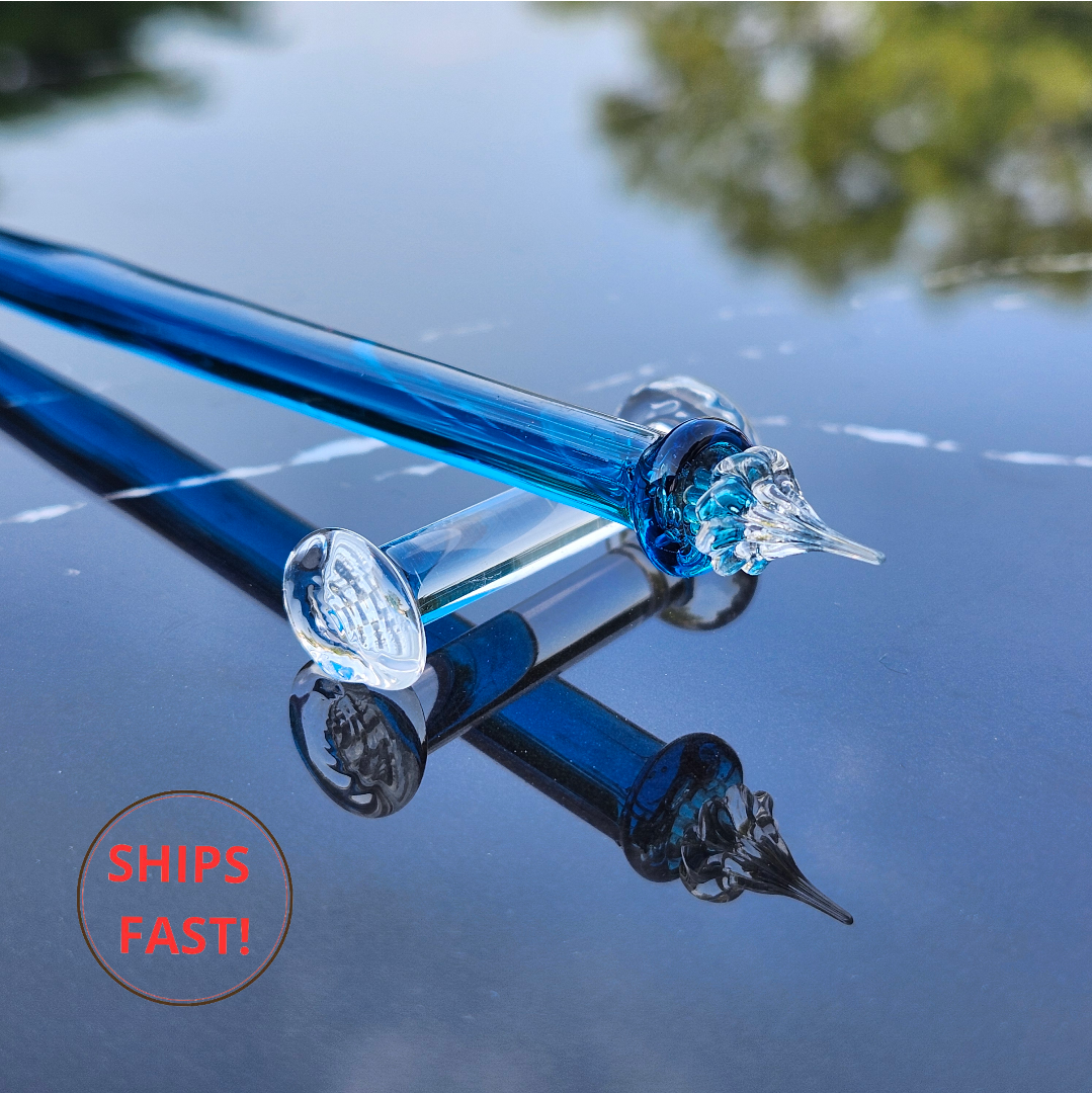 Cerulean blue glass dip pen with spiral tail and grooved tip inside wooden gift box