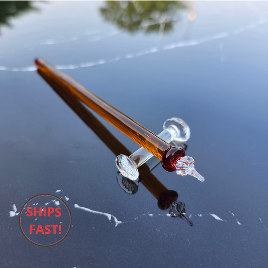 Close-up of handcrafted amber dip pen tip and grooved section with collar detail