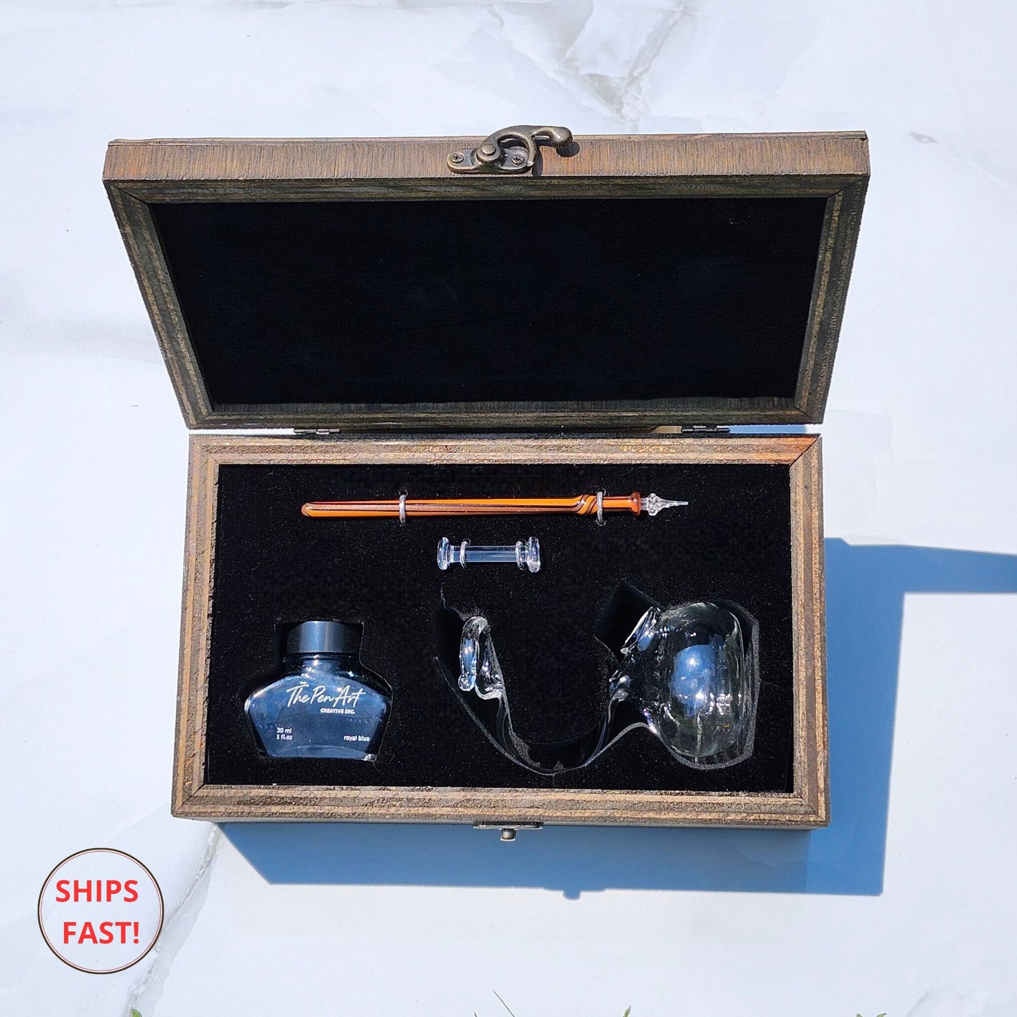 Collectible Ardor luxury glass pen photographed with ink bottle, orb, and artistic flame details