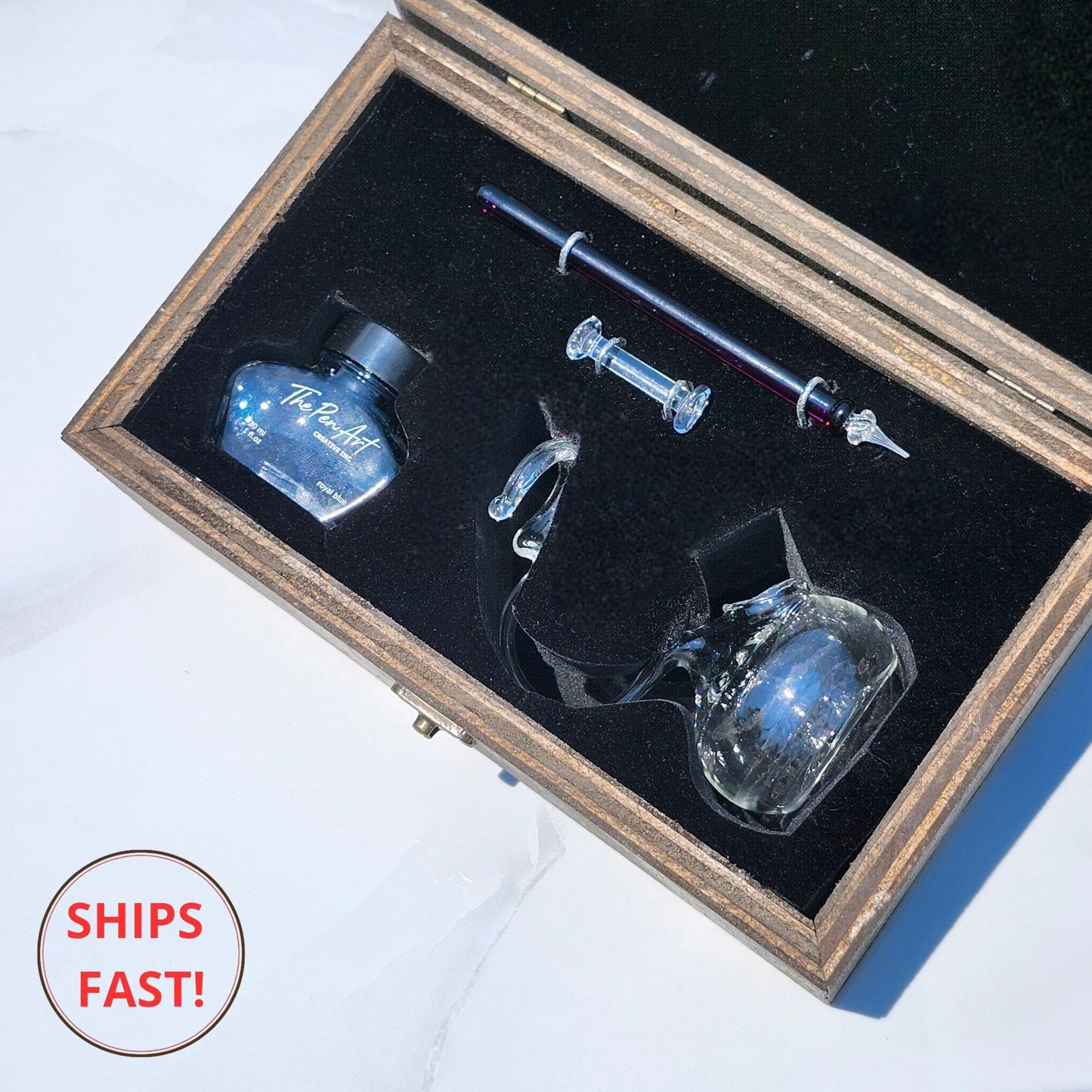 Deep red Claret glass dip pen set displayed with ink cleaning orb and luxury packaging