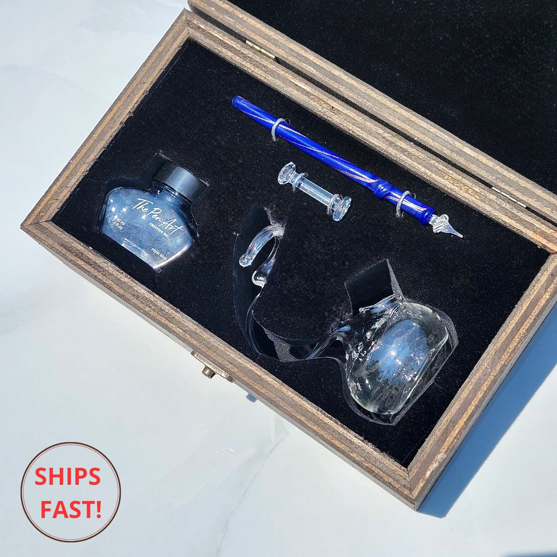 Artistic Mistral glass dip pen set with golden shimmer, ink bottle, and pen rest