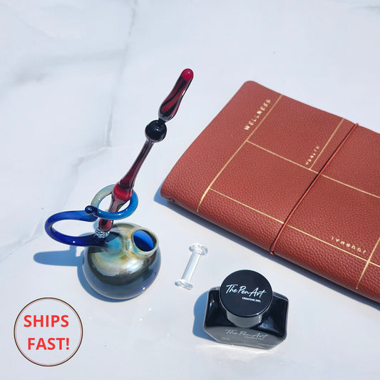 Salem glass dip pen in dark artisan tones, a hauntingly beautiful gift with engraved wooden box.